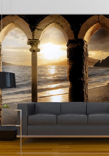 ARTGEIST Fototapet med motiv af arkitektur og udsigt til solnedgang ved stranden (flere strrelser)